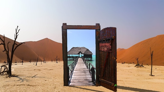 Image of desert with open door leading to a dock on a large body of water
